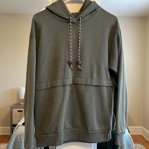 Wild fable green sweatshirt with orange, white black and green drawstrings.